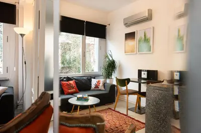 a living room with a couch and a table at Mayer Tatarbey Apartments in Istanbul