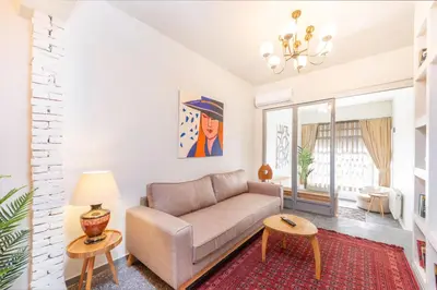 a living room with a couch and a table at Mayer Tatarbey Apartments in Istanbul