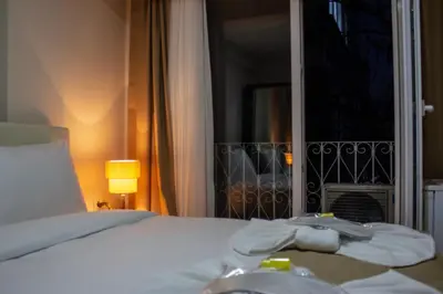a bedroom with a bed and a door with a balcony at Reggae in Istanbul