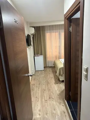 a hotel room with a door leading to a bedroom at Reggae in Istanbul