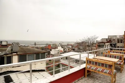 a balcony with a bench and a view of a city at Reggae in Istanbul