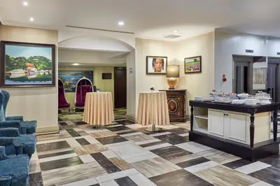 a lobby with two tables and a counter in a room at Konak Hotel Taksim in Istanbul