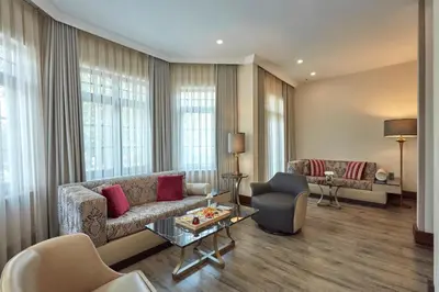 a living room with a couch and a table at Konak Hotel Taksim in Istanbul