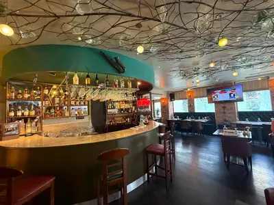 a bar in a restaurant with a green ceiling at Konak Hotel Taksim in Istanbul