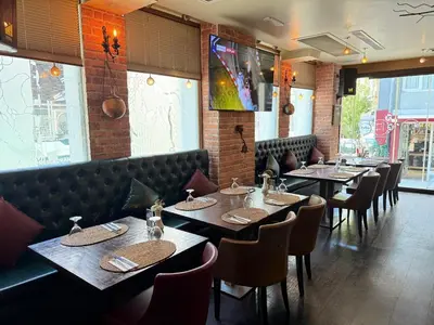 a dining room with tables and chairs in a restaurant at Konak Hotel Taksim in Istanbul