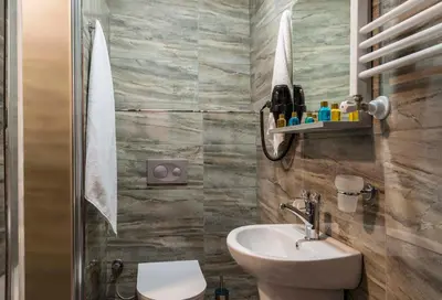 a bathroom with a toilet and a sink at Element Garden in Istanbul