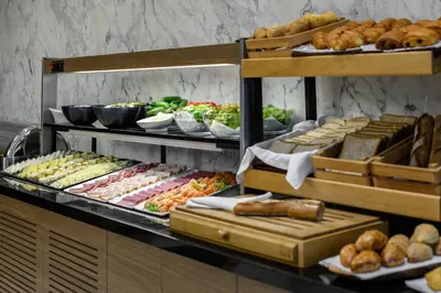 a buffet with many different types of food on display at Gleam Bomonti Hotel in Istanbul