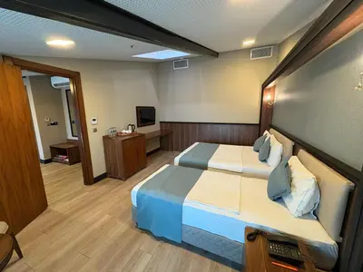 a hotel room with a bed and a television at Valens Hotel Downtown in Istanbul