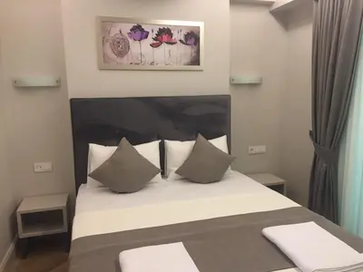 a bedroom with a large bed with pillows at KONAK BELLA 3 in Istanbul