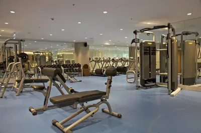 a gym with several treadmills and cardio machines at Rotta Hotel Istanbul in Istanbul
