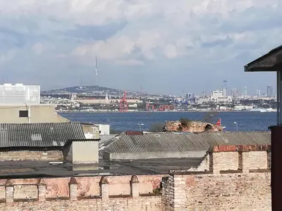 a view of the water from a building with roofs at Medellin Apart Hotel Istanbul in Istanbul