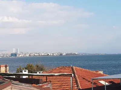 a view of the water and roofs of buildings at Medellin Apart Hotel Istanbul in Istanbul