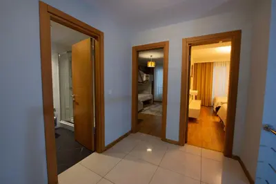 a hallway with two doors and a room with a bedroom at Three bedroom Duplex apartment with large terrace in Istanbul