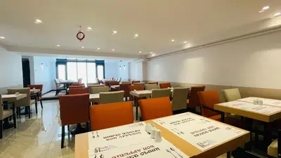 a restaurant with tables and chairs in a room at Osmanbey Fatih Hotel in Istanbul