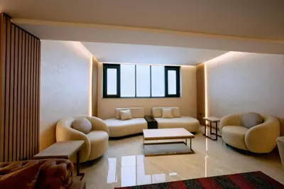 a living room with two chairs and a couch at Osmanbey Fatih Hotel in Istanbul
