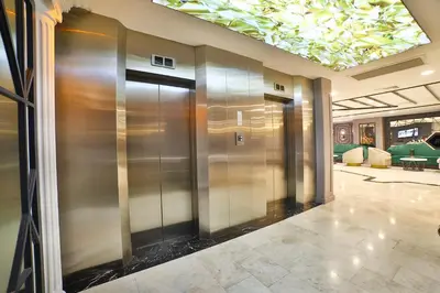 a row of elevators in a lobby with a ceiling at Four Sides Taksim Lion Hotel&Spa in Istanbul