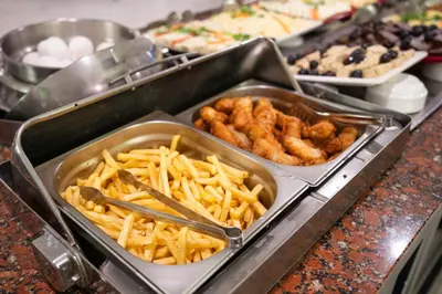 a buffet with several trays of food on a table at Four Sides Taksim Lion Hotel&Spa in Istanbul