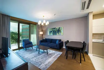 a living room with a couch and a table at Radisson Residences Vadistanbul in Istanbul