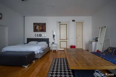 a bedroom with a bed and a table in it at PUHU OTEL in Istanbul