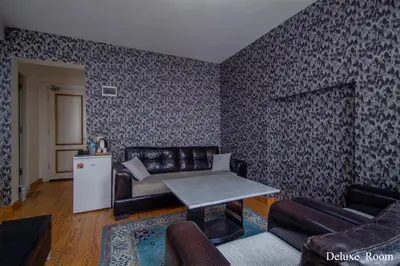 a living room with a couch and a table at PUHU OTEL in Istanbul