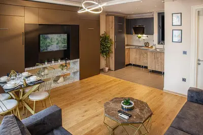 a living room with a couch and a table at Norah Suites Hotel İstanbul in Istanbul