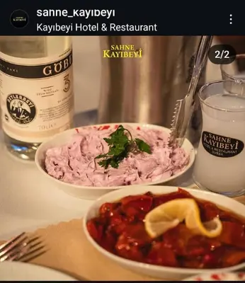 a table with two bowls of food and a drink at Kayıbeyi Hotel & Restaurant in Bursa