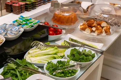 a buffet with bowls of vegetables and other foods at Mr. Bird Hotel in Istanbul