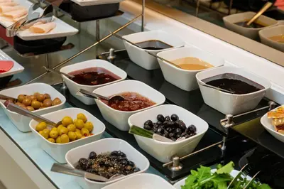 a buffet with many bowls of food on a table at Mr. Bird Hotel in Istanbul