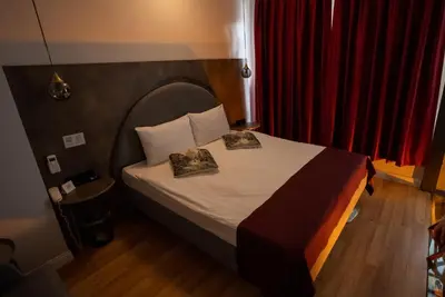 a bedroom with a bed with two pillows on it at Corner Hot in Istanbul