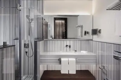 a bathroom with a sink and a shower at DeCamondo Galata, a Tribute Portfolio Hotel in Istanbul
