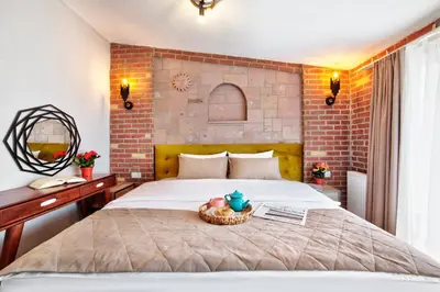 a bedroom with a bed with a bowl of fruit on it at Ardilas Residence in Istanbul