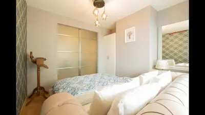 a living room with a couch and a bed at CTS Elysium Residence Duplex Apt. 85 in Istanbul