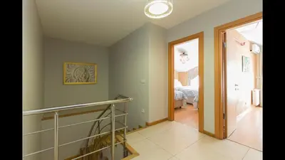 a hallway with a staircase in a house at CTS Elysium Residence Duplex Apt. 85 in Istanbul