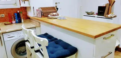 a kitchen with a counter with a washing machine at Boğazın incisi.. in Istanbul