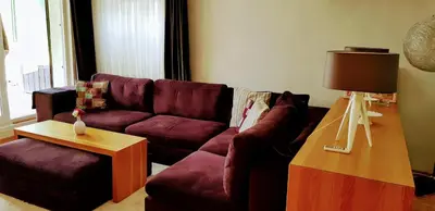 a living room with a purple couch and a table at Boğazın incisi.. in Istanbul