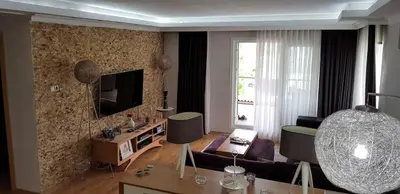 a living room with a couch and a tv at Boğazın incisi.. in Istanbul