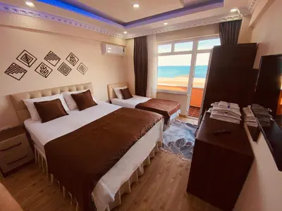 a hotel room with two beds and a window at istanbul Airport Kumsal Otel in Arnavutköy
