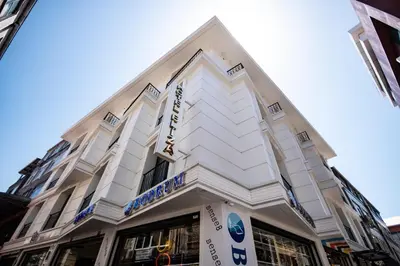 a white building with a sign on the front of it at Eliza Hotel in Istanbul