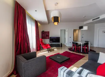 a living room with a couch and a table at Armoni Residence & Hotel in Istanbul