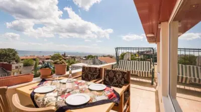 a table on a balcony with a view of the ocean at Front of Sea View Apartments Sultanahmet SEA VIEW in Istanbul