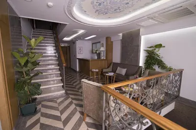 a hallway with a staircase with a stair case at Cumbali Suite Hotel in Istanbul