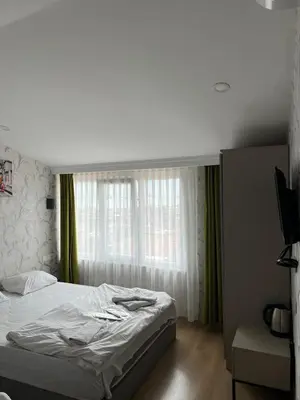 a bedroom with a bed and a window at The Lola Hotel in Istanbul