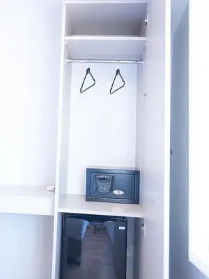 a closet with a small radio on a shelf at The Lola Hotel in Istanbul