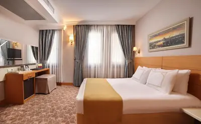 a hotel room with a bed and a sink at Almina Hotel - Special Class in Istanbul