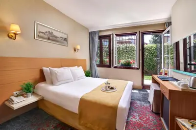 a hotel room with a bed and a sink at Almina Hotel - Special Class in Istanbul