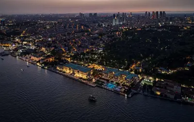 an aerial view of a city at night at Çırağan Palace Kempinski Istanbul in Istanbul