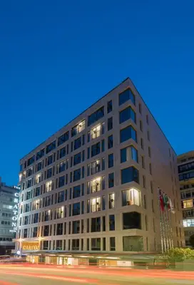 a tall building with lights on in a city at The Craton Hotel Sisli in Istanbul
