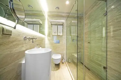 a bathroom with a toilet and a glass shower at The Haze Karaköy in Istanbul