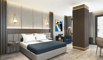 a bedroom with a bed and a living room at Arts Hotel Taksim in Istanbul