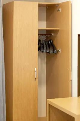 a cupboard with a bunch of shoes in it at Kartal Palace Taksim Square FAMILY HOTEL in Istanbul